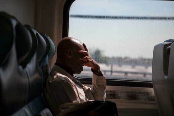 A man rides the Long Island Railroad to New York City.   Joseph Amandola III © 2015